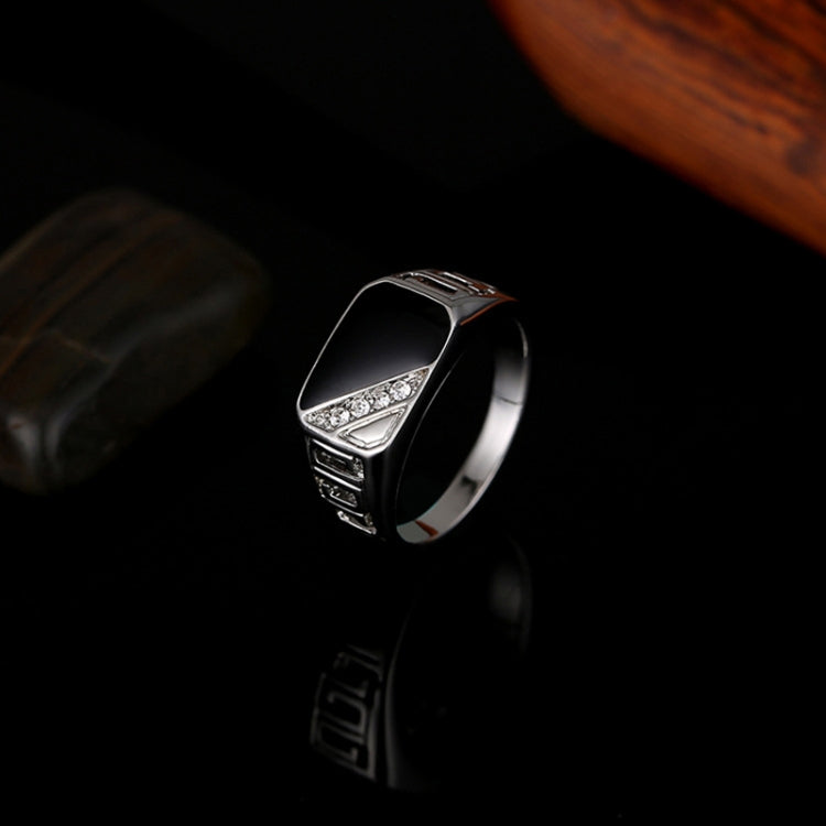 Silver-tone band ring with black enamel top and rhinestone trim, side view