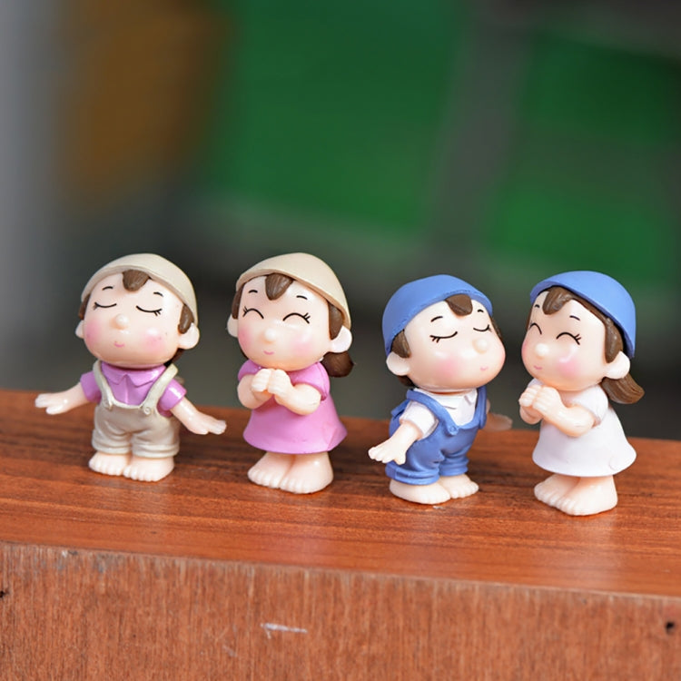 Set of 4 mini cartoon house figurines on a surface: purple, pink, blue, and white