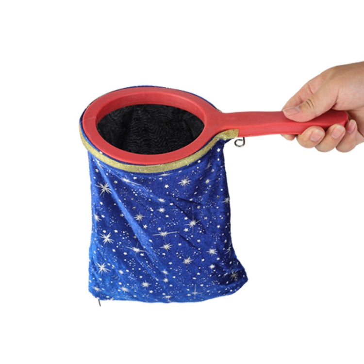 Blue star-pattern change bag prop with red handle and gold-trimmed opening.