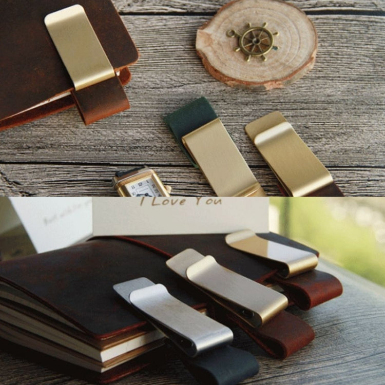 Metal pen holder clips with leather sleeves in mixed colors on wooden surface