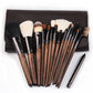 Fifteen makeup brushes in a brown leather-look case with silver ferrules