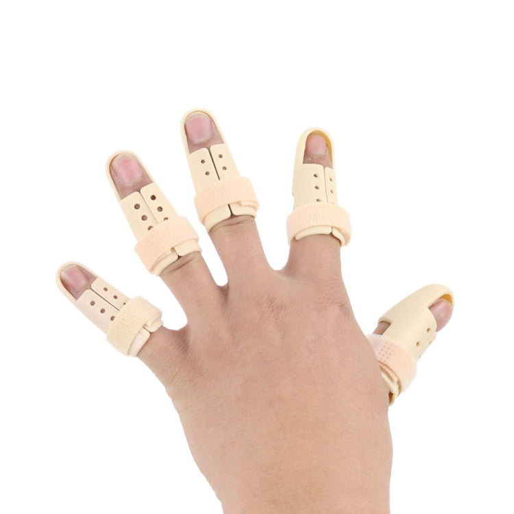 Adjustable finger splint set in beige on hand, perforated braces with straps