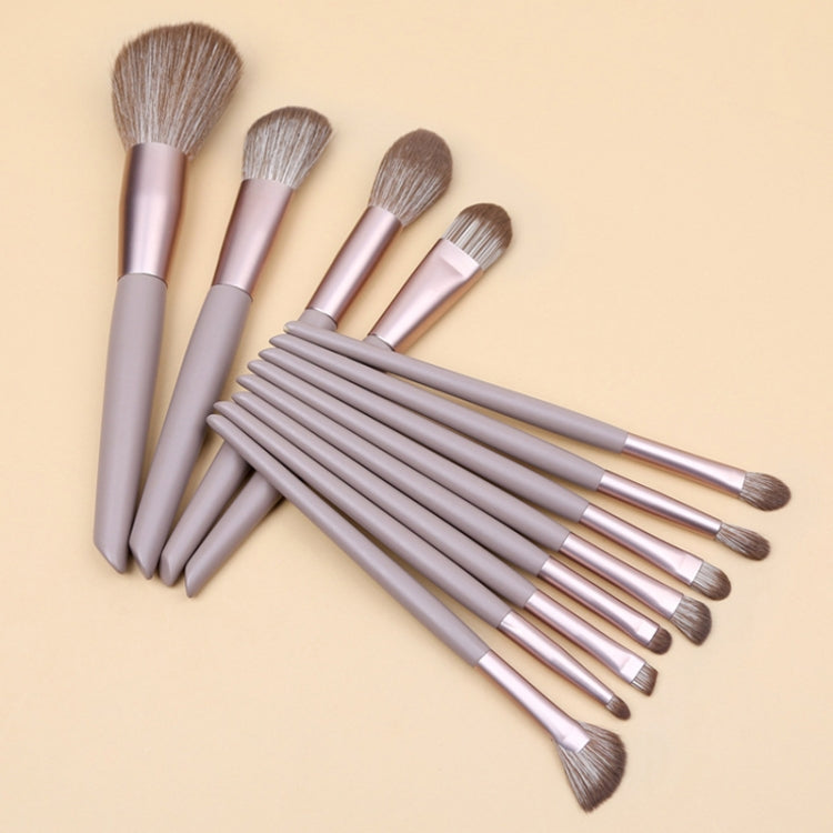 12-piece makeup brush set with lilac handles and brown bristles, angled view