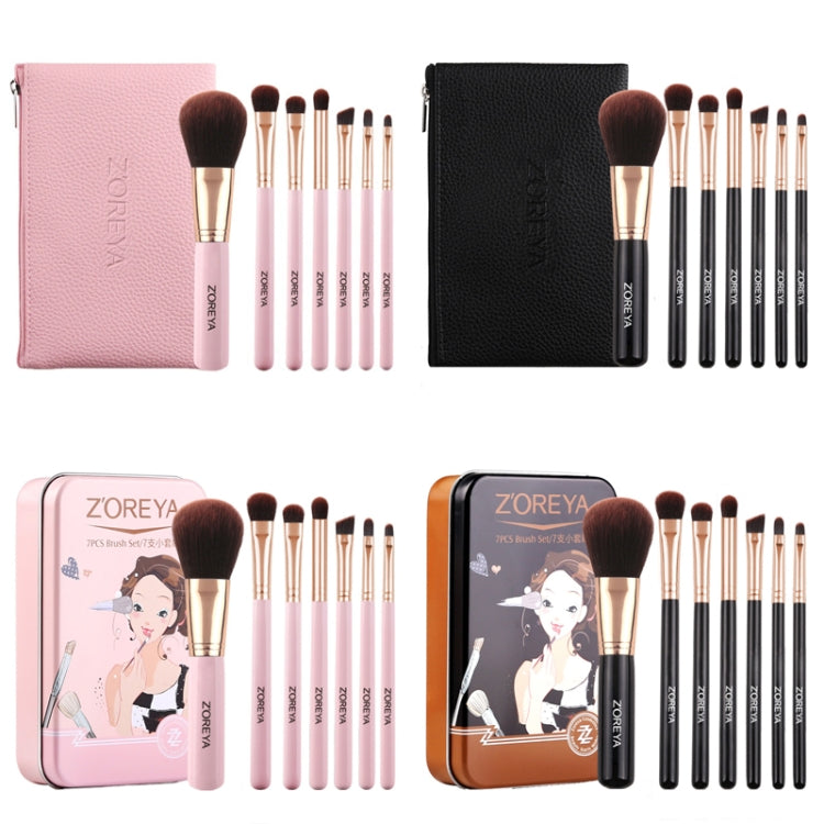 Makeup brush set with pink and black zip pouches and gold-handled brushes