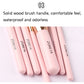 Pink makeup brush handles with ZOREYA print and brown bristles