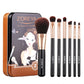 Black makeup brush set with metal case, gold ferrules and brown bristles