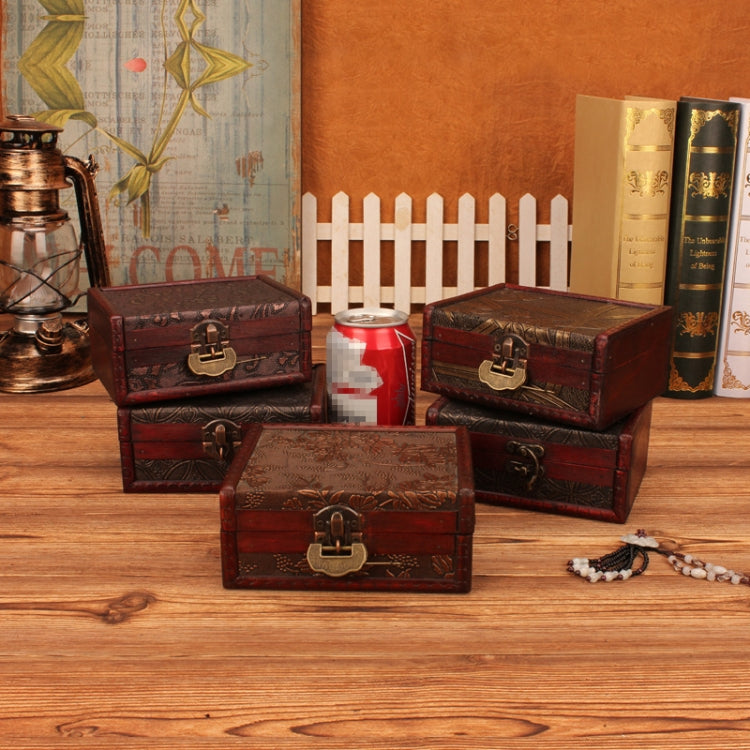 Vintage wooden jewelry box with red engraving, plus other matching boxes on tabletop