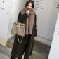 Thick chunky knit wool scarf, solid brown/tan, worn looped around neck