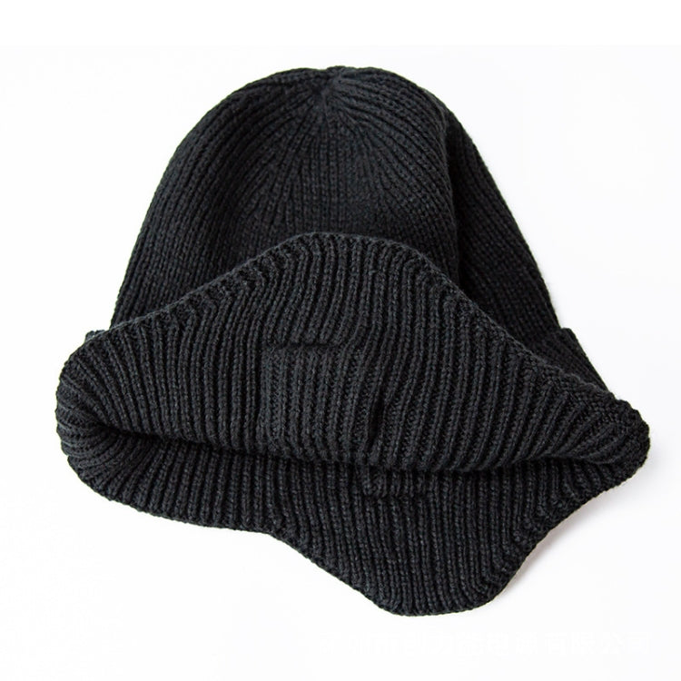 Black fold-over knit Bluetooth music hat, ear-covered shape and brown control patch