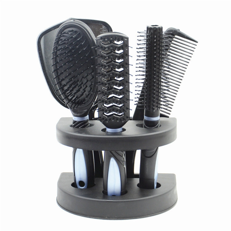 Hair comb brush set on rotating base: black paddle, vented, and fine-tooth combs