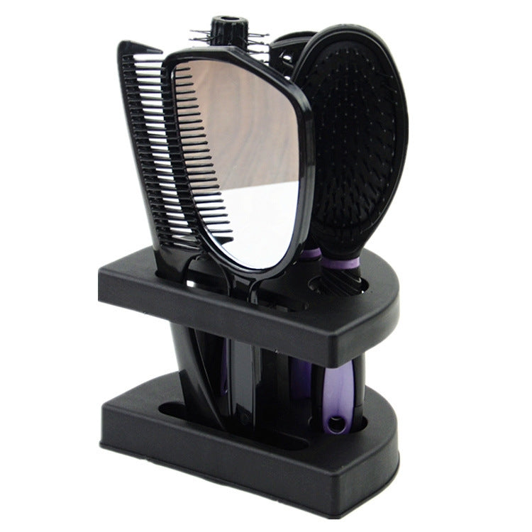 Compact hair comb set with mirror-backed brush and mixed bristle combs on stand