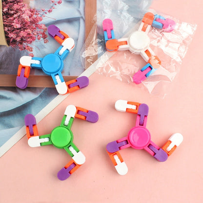 Colorful plastic finger spinner toy with cross-shaped rotating chain blocks