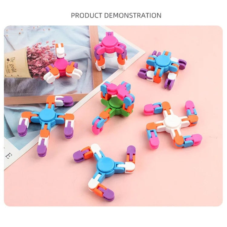 Multiple colorful plastic finger spinner toys showing rotating chain track segments