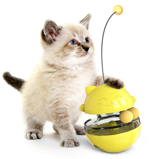 Cat treat dispenser toy with two rolling balls, yellow bowl and lid, with hanging string and ball.