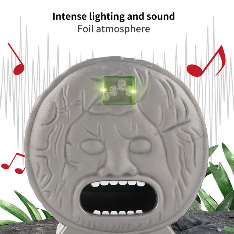 Gray brain-shaped electronic prank toy with green LED screen and open bite mouth.