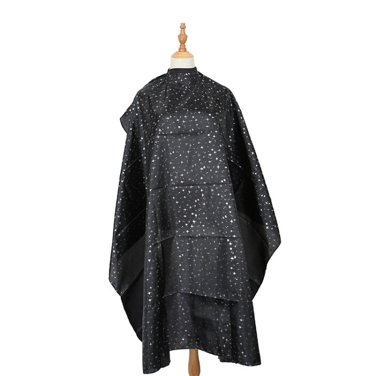 Black salon hair-dye cape with star speckle pattern, snap closure and full coverage