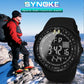 Black digital sports watch with luminous display, worn during outdoor activity