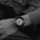 Black digital sports watch close-up on wrist, electronic display shown