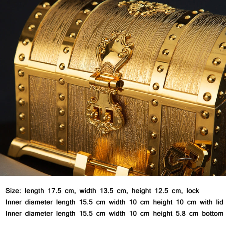 Gold metal jewelry chest with detailed filigree lock and studded side panels