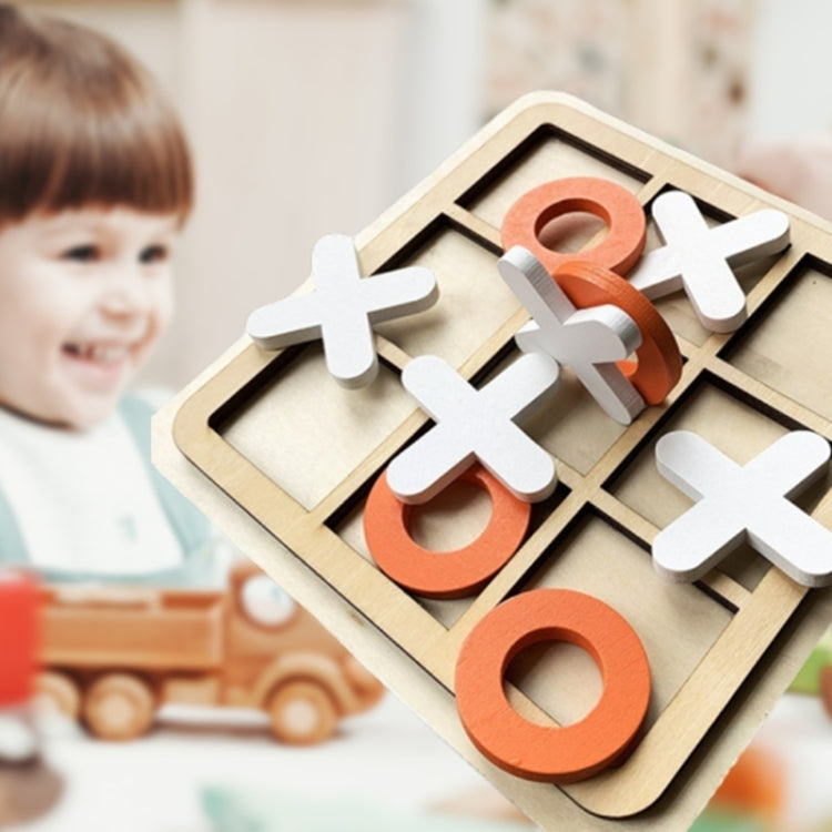 Wooden tic-tac-toe board with orange X and black O pieces ready to play