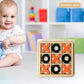 Kids tic-tac-toe board game with orange X and black O pieces