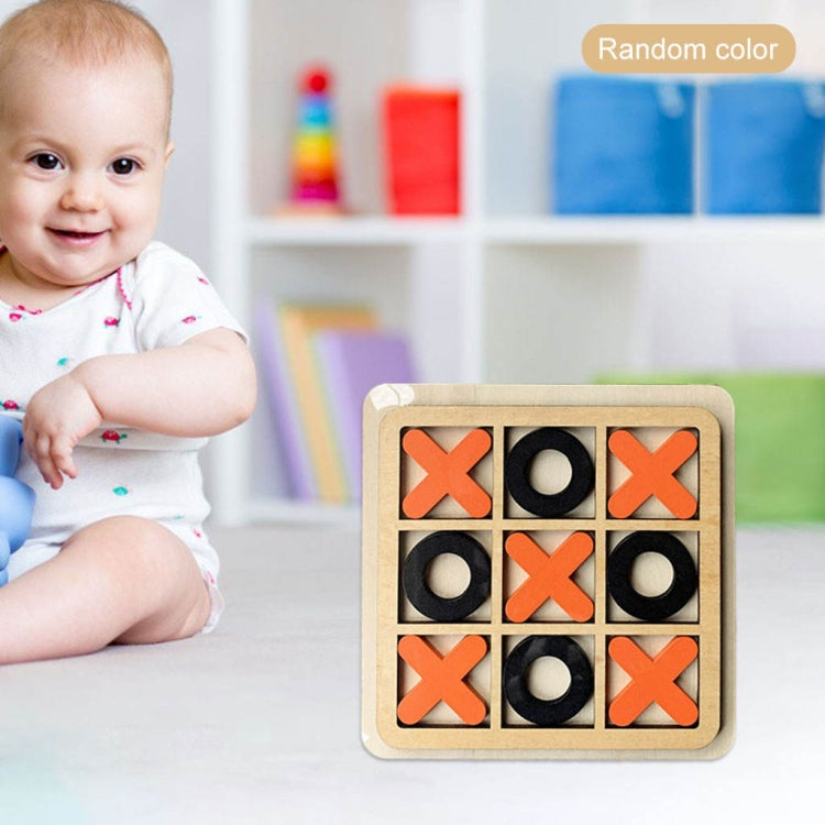 Kids tic-tac-toe board game with orange X and black O pieces