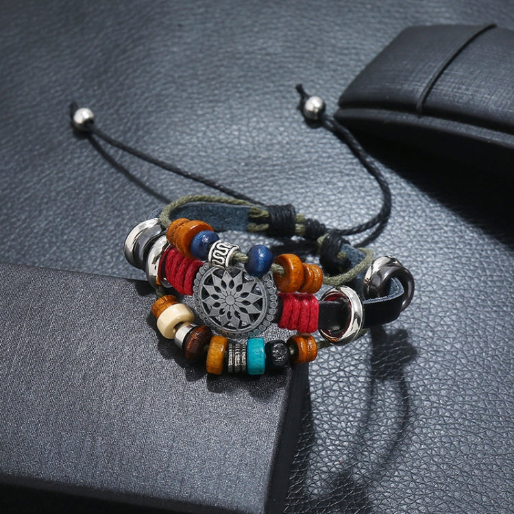 Beaded leather bracelet with circular silver charm, blue red beads, wood beads and rings