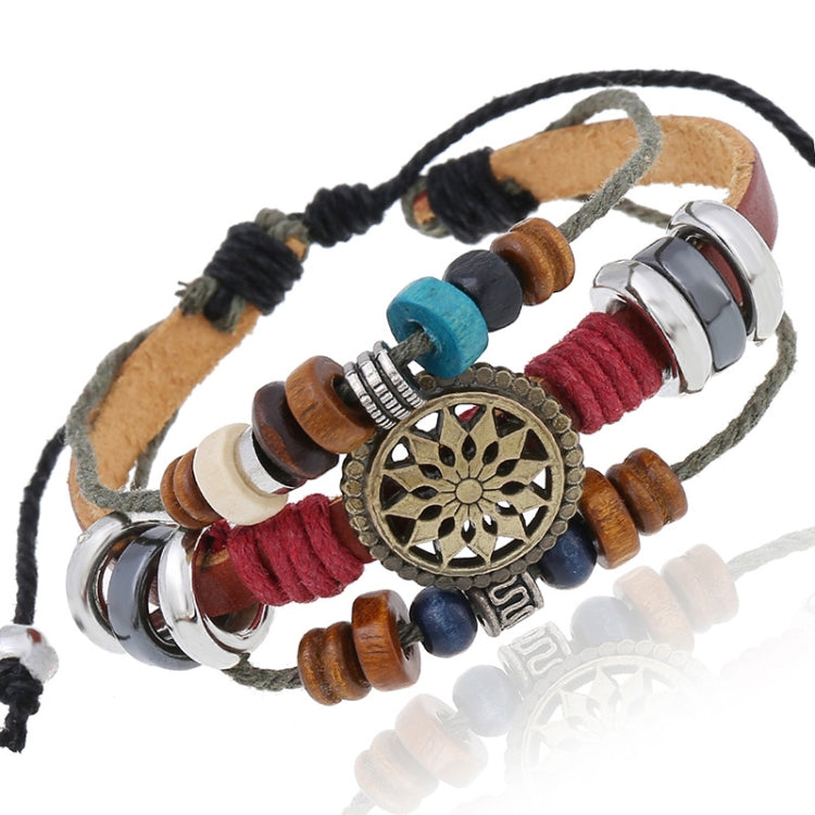 Beaded leather bracelet with circular bronze-gold charm, red blue and teal beads, tube accents