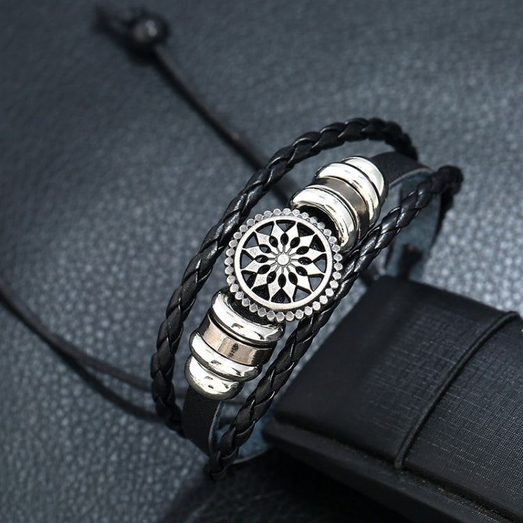 Adjustable braided leather bracelet with large round floral medallion and silver accents