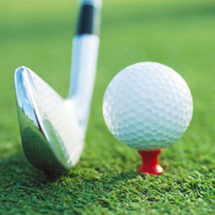 Plastic golf ball tee with white shaft holding a golf ball