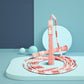 Pink and white bamboo-style PVC skipping rope, coiled with hand grips