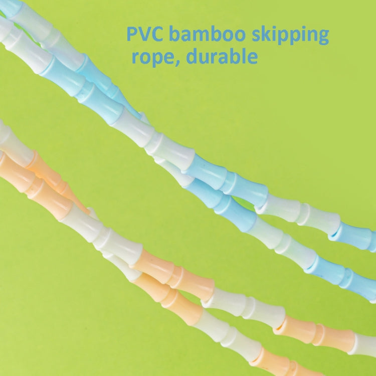 Close-up of bamboo-style PVC skipping rope with light blue and peach segments