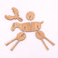 Wooden elk decoration pieces in light wood, flat cutouts with antlers and body