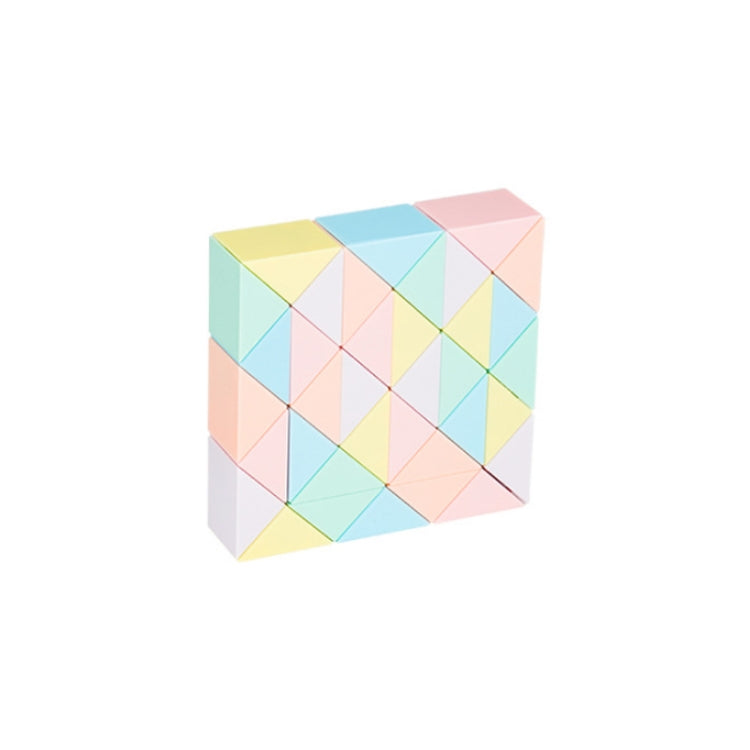 Pastel magic ruler puzzle toy with interlocking triangular blocks, angled view