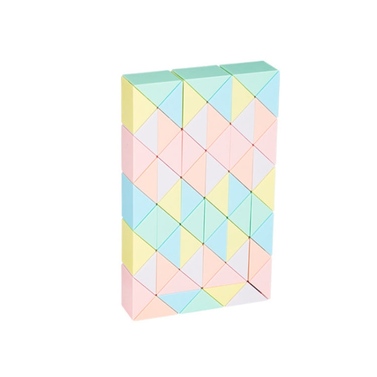 Light pastel magic ruler puzzle toy with interlocking blocks, tilted view