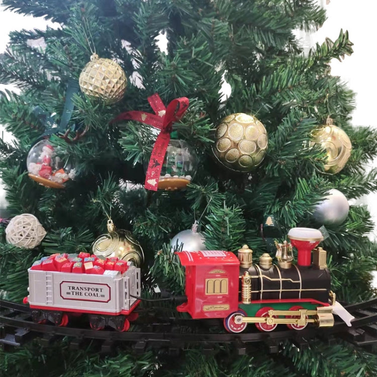 Christmas train rail car model wrapped in lights and ornaments on a decorated tree