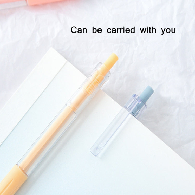 Orange and blue utility knife pens with clear blade sleeves angled over paper