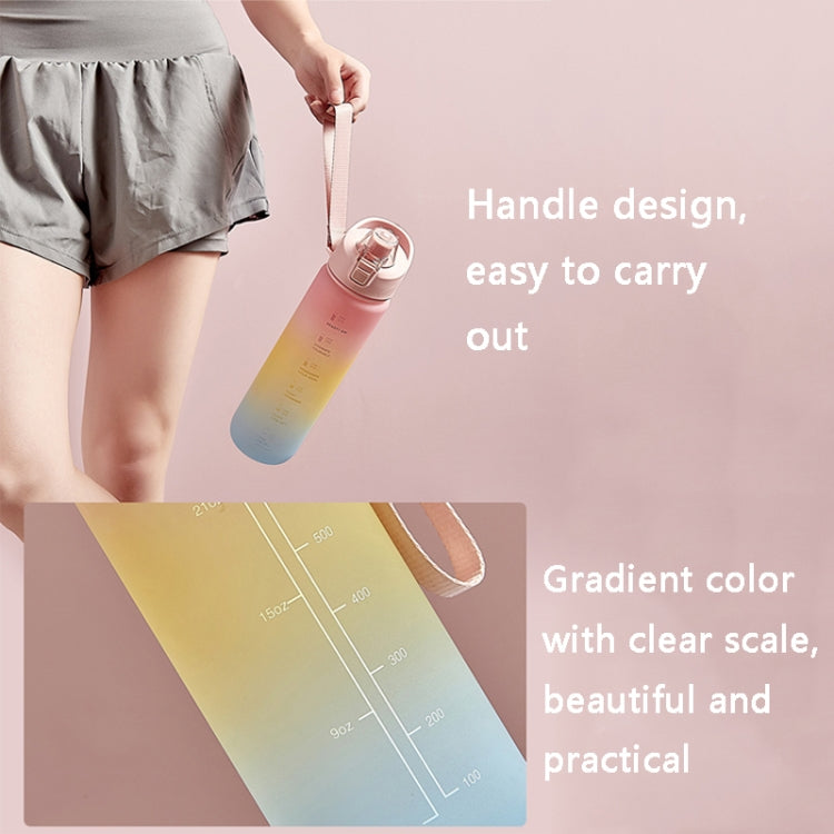 Cherry pink to sky blue gradient sports water bottle with carry handle and clear measurement markings