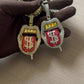 Pair of rhinestone lips tongue pendant necklaces, gold and silver with red enamel.