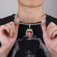 Silver rhinestone choker necklace with red enamel lips tongue pendant on model.