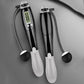 Electronic counting cordless skipping rope set, black handles with gray grips and LCD display