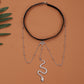 Snake long anklet body chain featuring elastic black band and silver-tone snake pendant