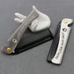 Folding beard styling comb with black teeth and white folding covers