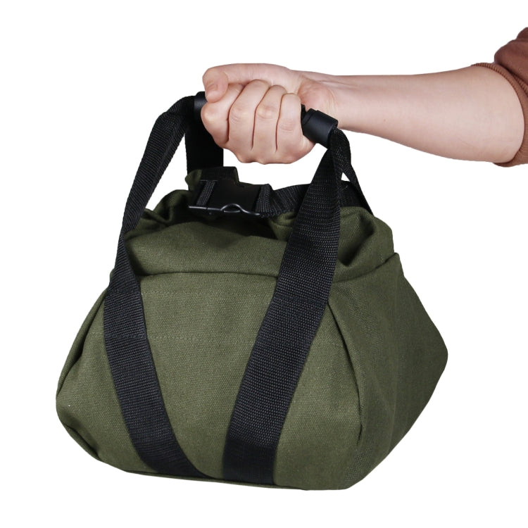 Olive canvas weight sandbag with black webbing handles, held by top strap