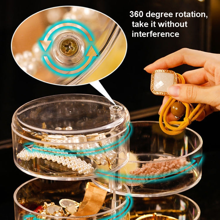 Transparent rotating jewelry box with front tier holding small accessories