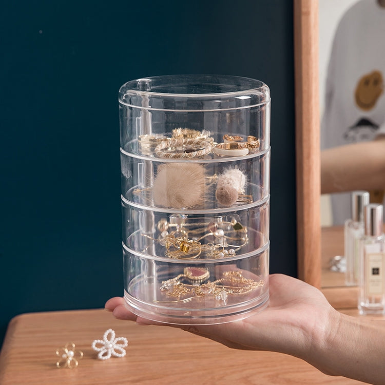 Clear acrylic 4-layer jewelry box on stand with multiple earring and ring pieces