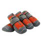Orange mesh dog shoes with hook-and-loop straps and gray rubber tread soles, 4-pack.