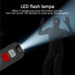 Black personal alarm device with LED flash beam visible, showing red and gray buttons.
