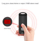 Black personal alarm device with red alarm button pressed by hand; alert ring effect.