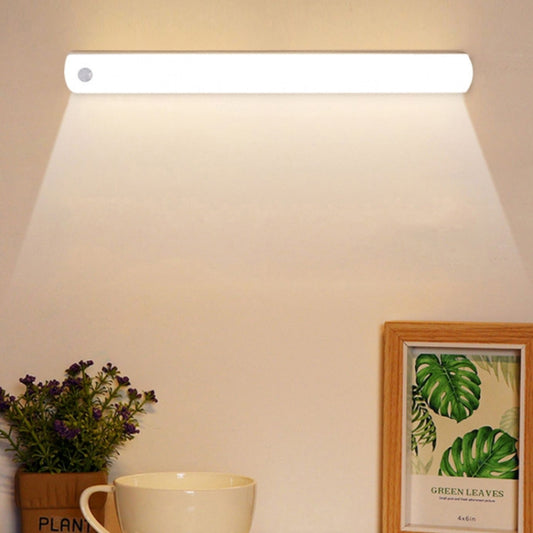 Rechargeable LED cabinet light bar with slim white housing, unlit under a shelf